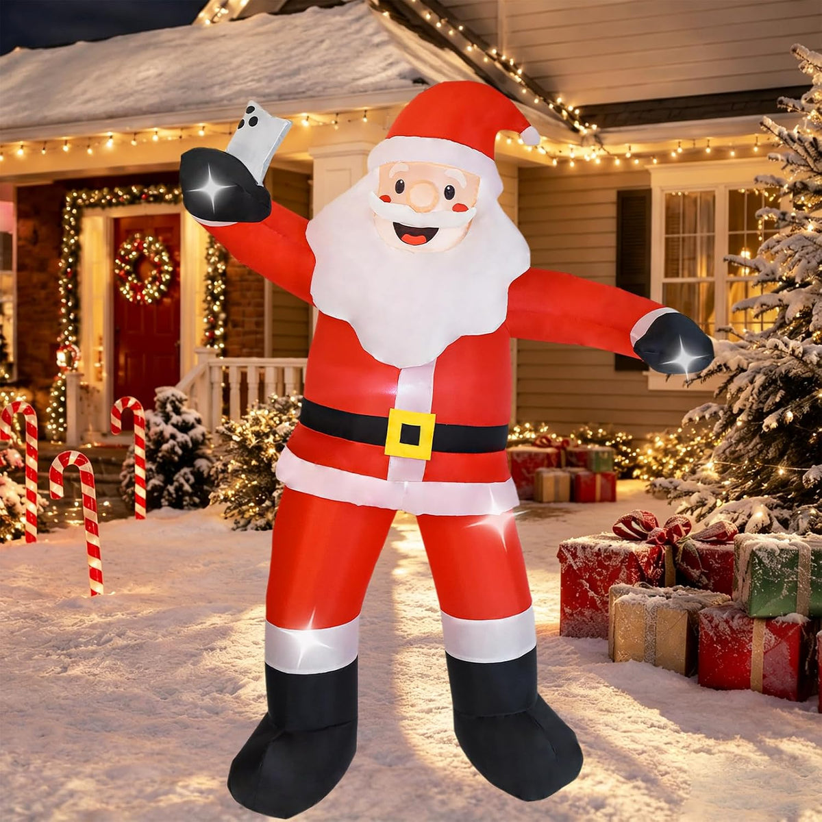 Inflatable classic Santa waving on a front lawn at dusk